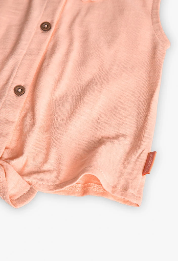 T-shirt en maille pour bébé fille de couleur saumon avec détail en dentelle.