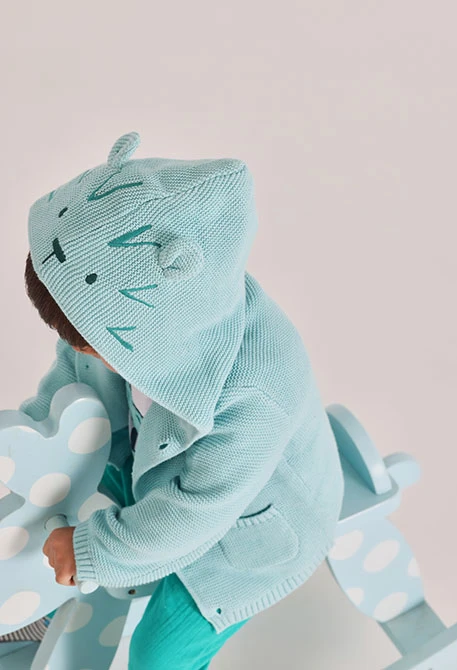 Green knit baby jacket