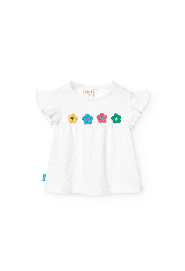 Maglietta a maglia per bambina in colore bianco con design di fiori ricamati.