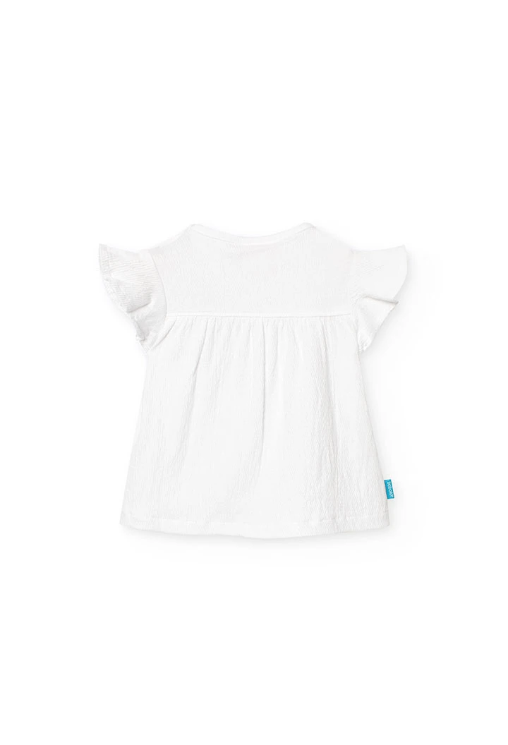 Maglietta a maglia per bambina in colore bianco con design di fiori ricamati.
