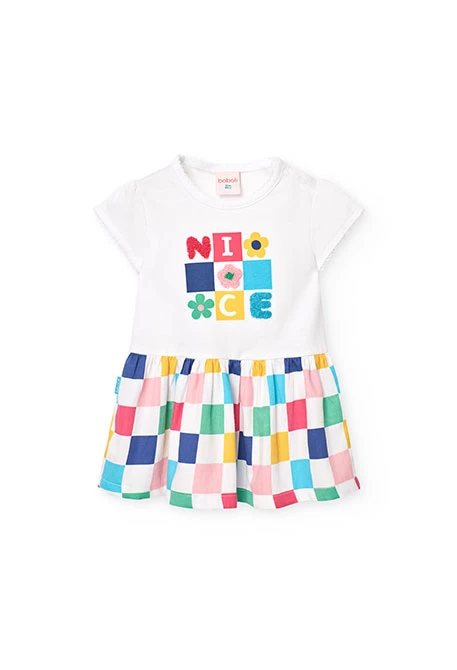 Robe en maille combinée pour bébé fille avec un design à carreaux de couleur blanche.