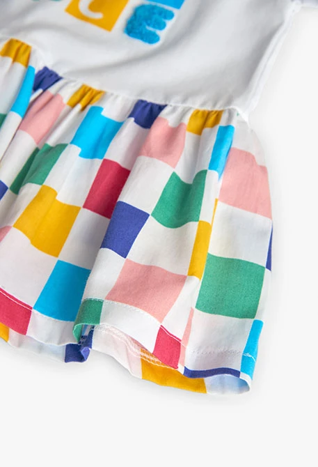 Robe en maille combinée pour bébé fille avec un design à carreaux de couleur blanche.