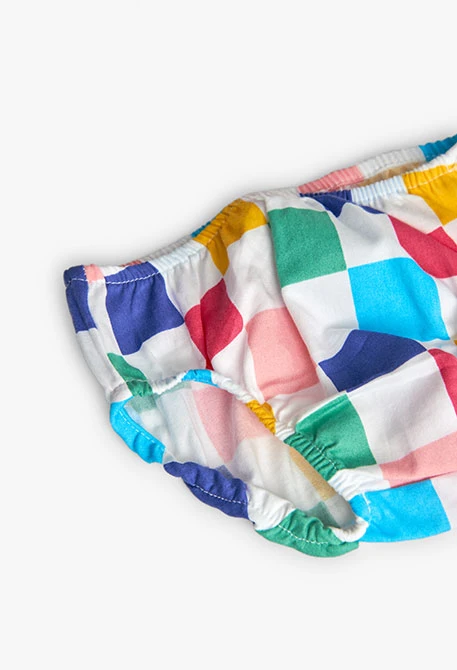 Robe en maille combinée pour bébé fille avec un design à carreaux de couleur blanche.