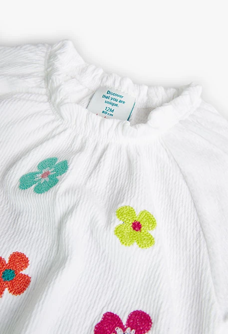 T-shirt tricoté caoutchouté pour bébé fille de couleur blanche