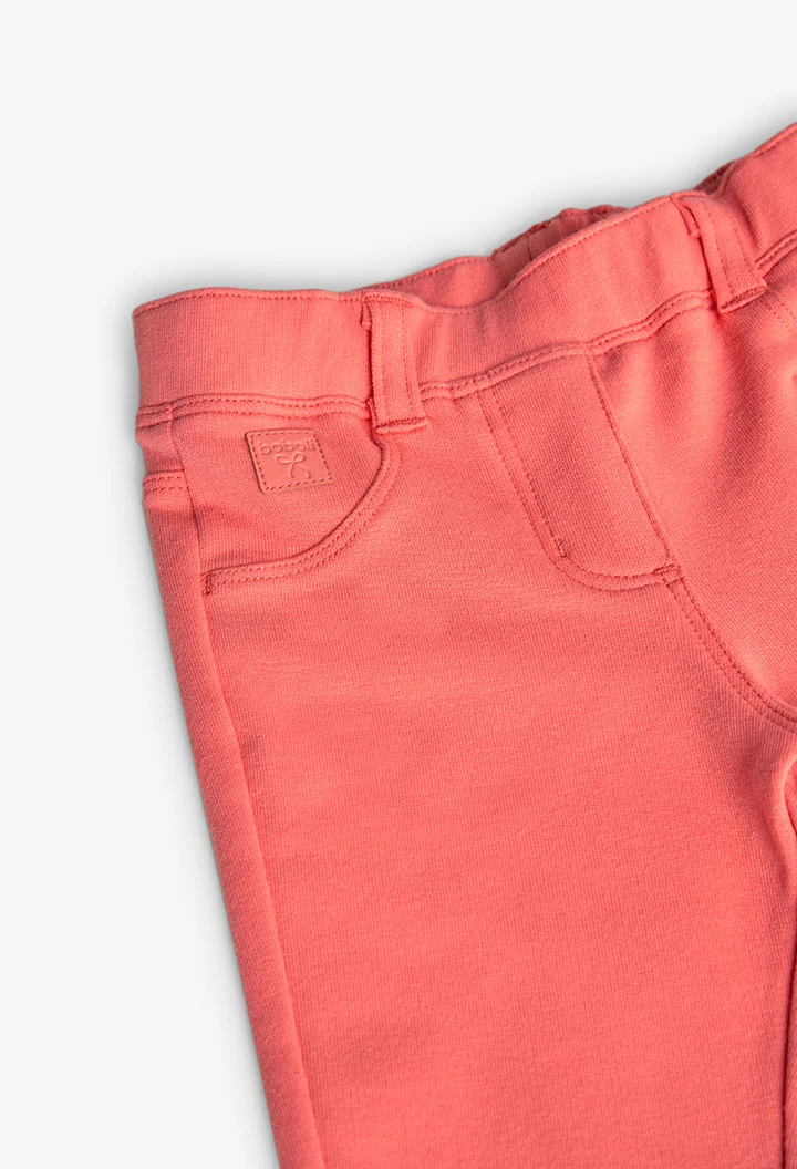 Baby girl\'s plush trousers in red.