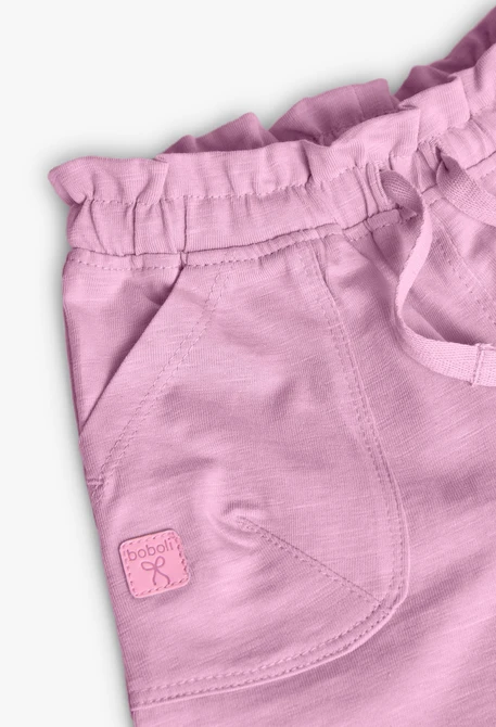 Pantaloncini in maglia per neonata di colore rosa