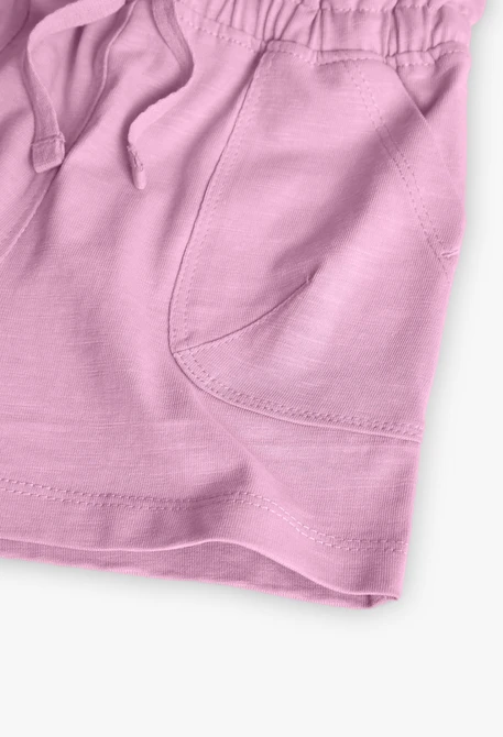 Pantaloncini in maglia per neonata di colore rosa