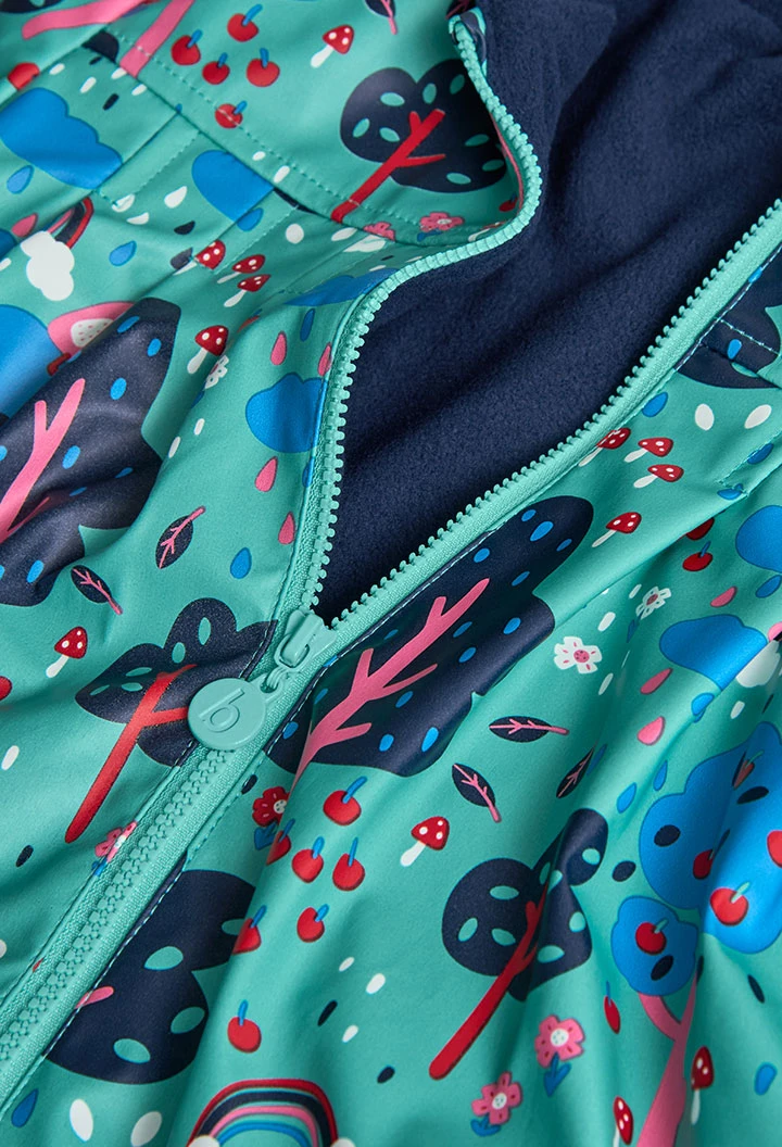 Manteau imperméable vert et bleu arbres et des nuages