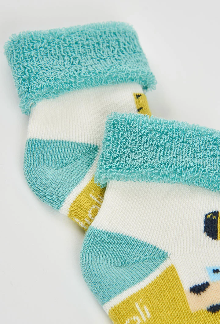 Pack of white baby socks with giraffe print