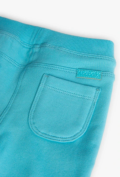 Elastic plush trousers for baby girl in blue