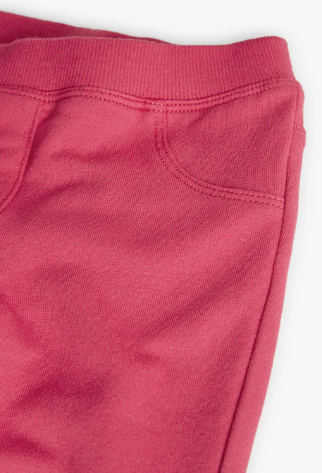 Elastic plush trousers for baby girl in red