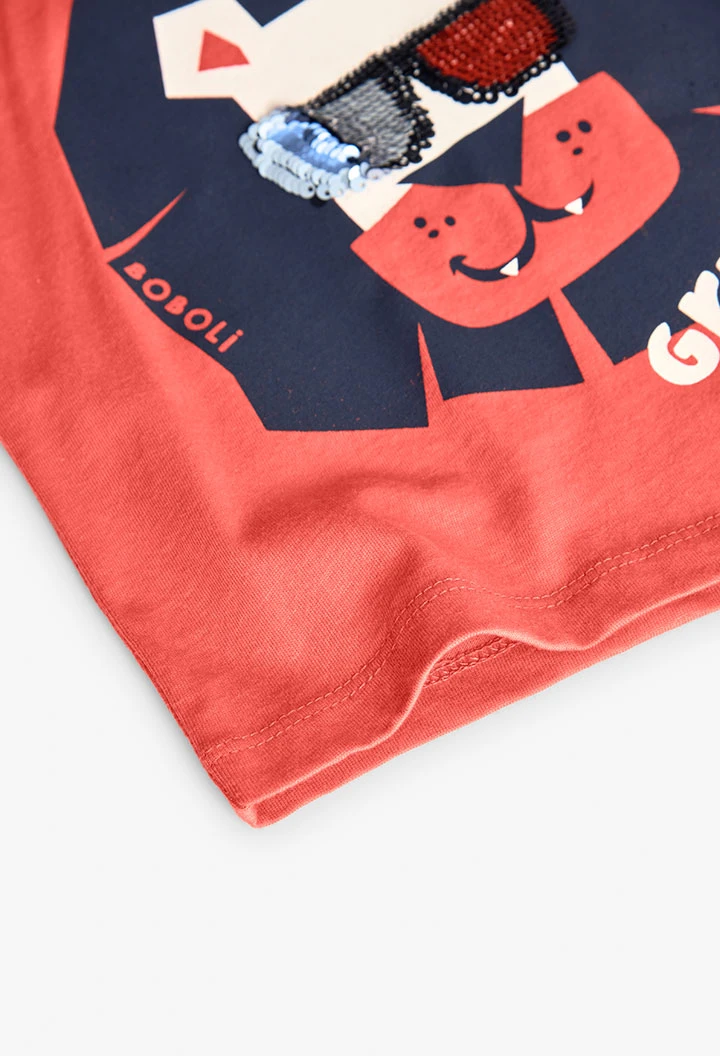 Maglietta a maglia per neonato di colore rosso con stampa di leone.