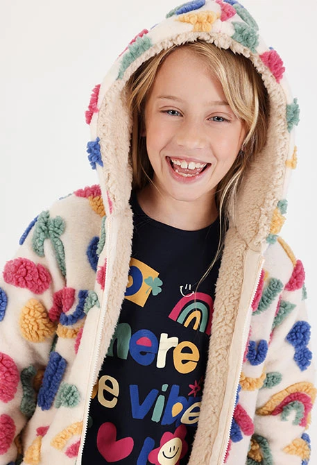 Giacca lunga in pelliccia grezza da bambina con stampa multicolore