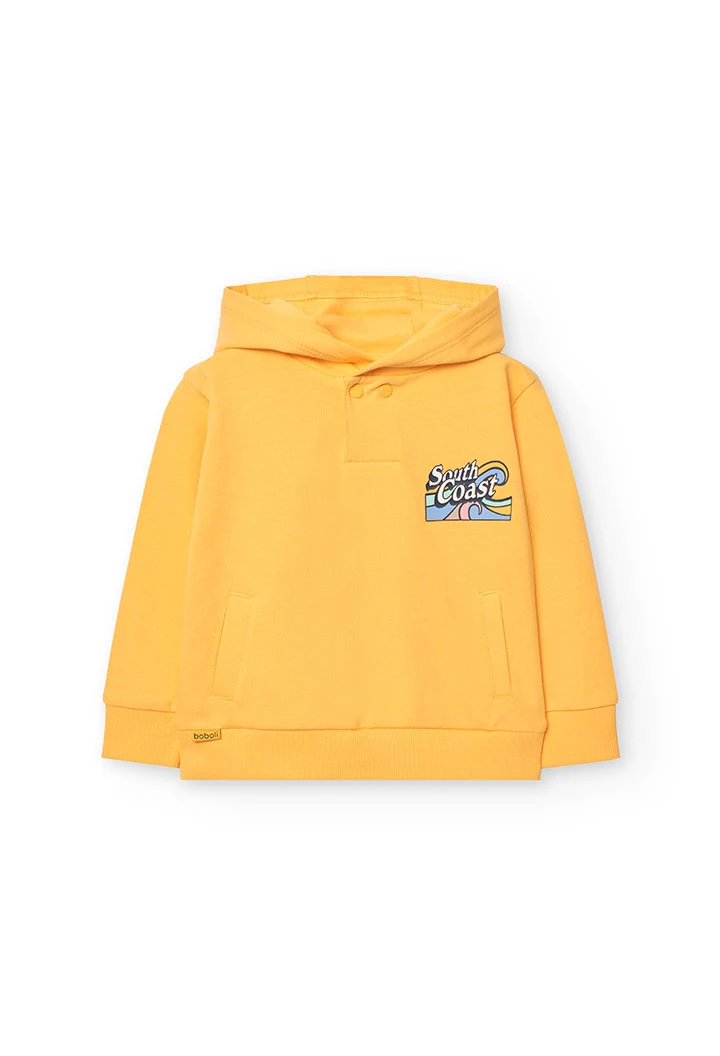 Felpa per neonato di colore giallo.
