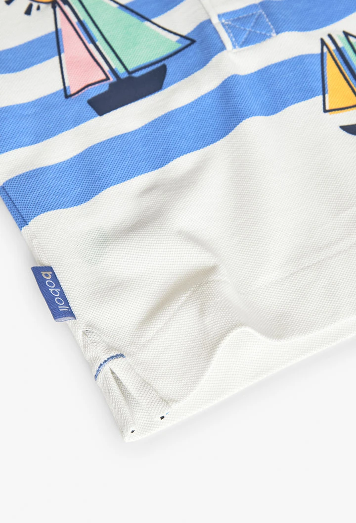 Polo lavorato a maglia per neonato di colore bianco con stampa nautica.