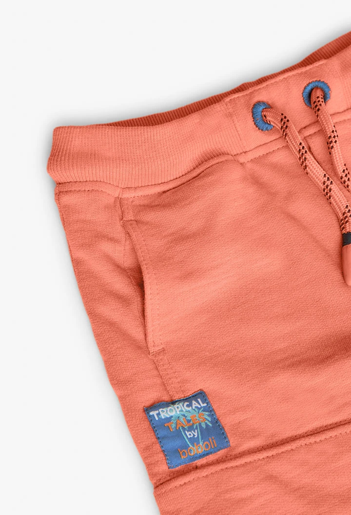 Bermuda a maglia per bambino in colore arancione