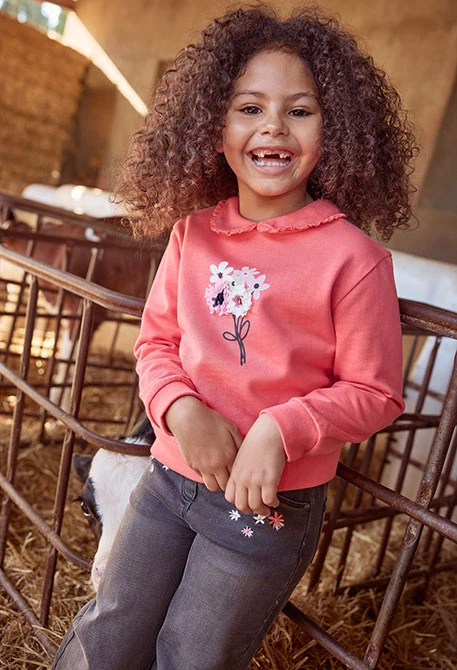 Black embroidered floral denim trousers for girls