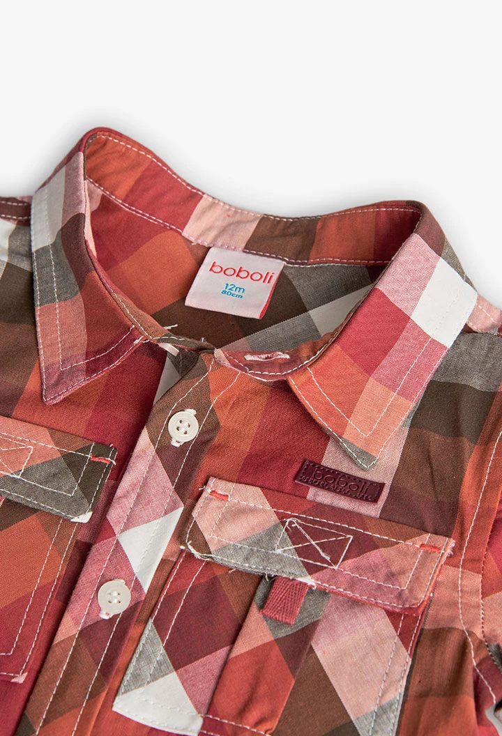 Camicia in popeline per bambino con quadri in tonalità calde.