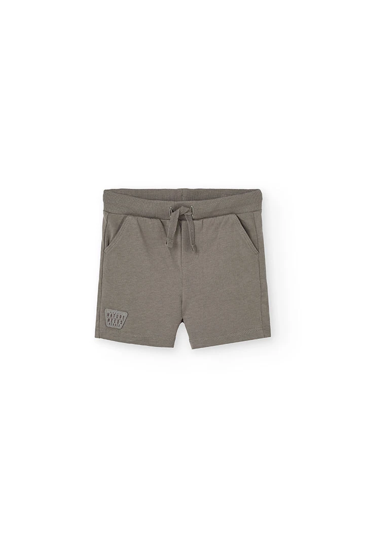 Completo con maglietta a maglia per bambino in colore crema.