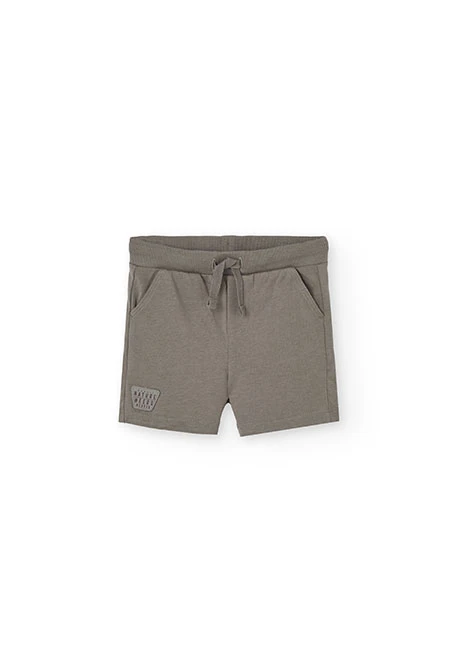 Completo con maglietta a maglia per bambino in colore crema.