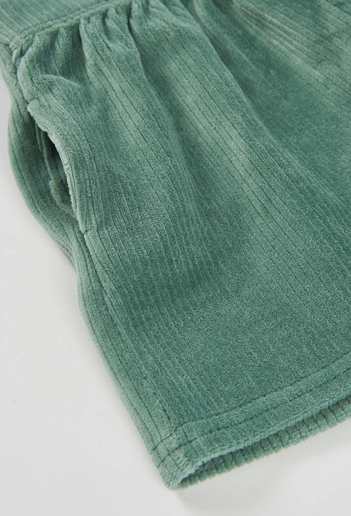Scaldacuore verde con bretelle incrociate