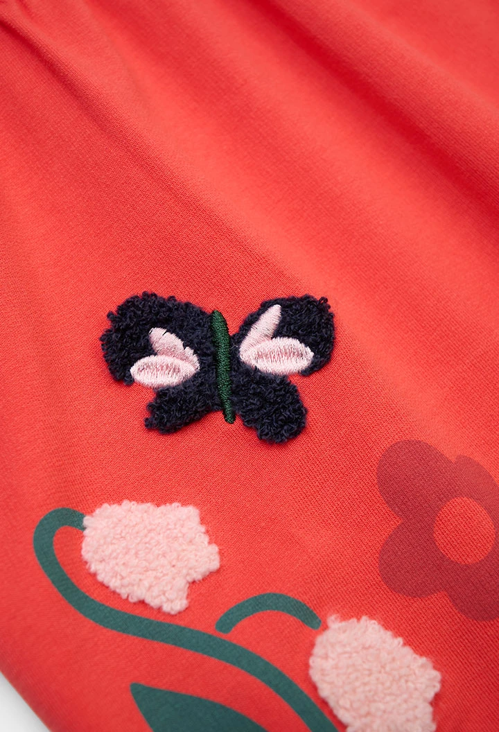 Orangefarbenes Plüschkleid mit Blumendruck