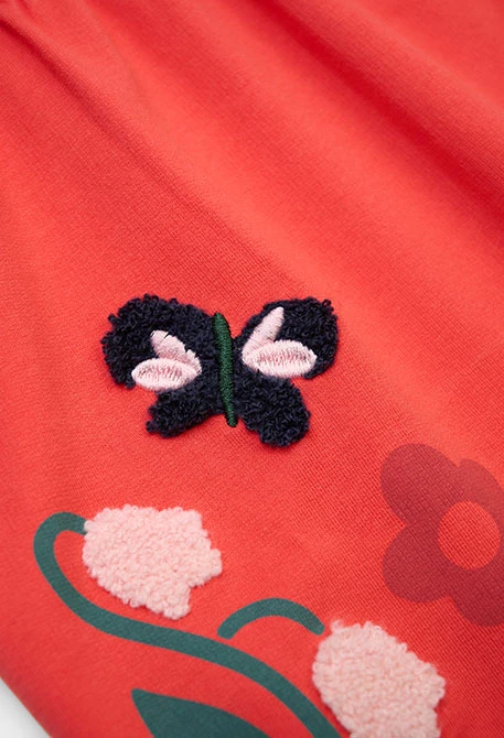 Vestido em pelúcia laranja com estampado floral