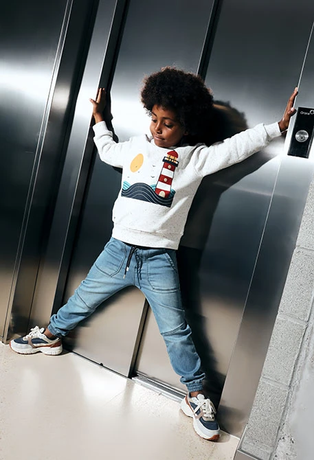 Elastic blue denim trousers for boy