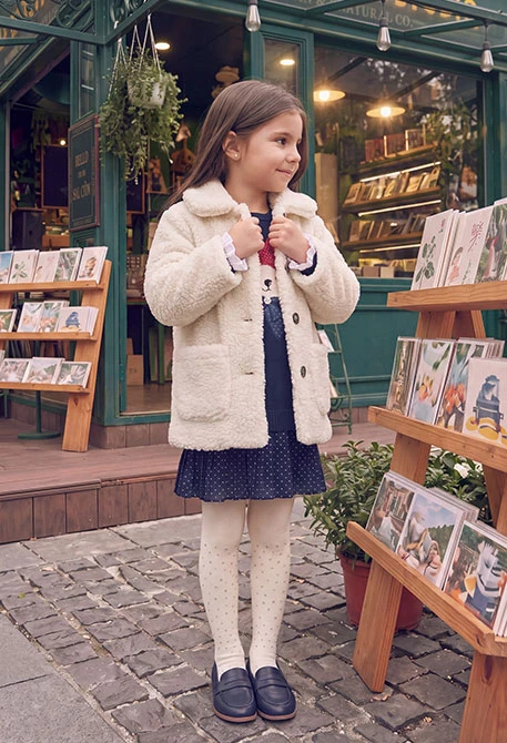 Girl\'s white shearling coat