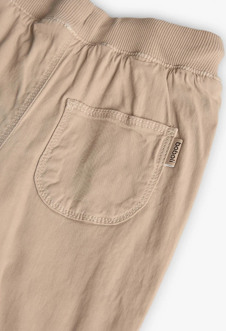 Pantalon garçon beige en coton élastique