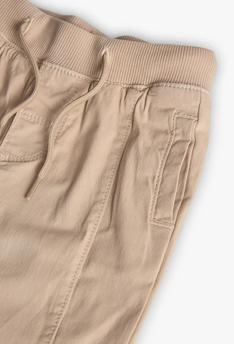 Pantalon garçon beige en coton élastique