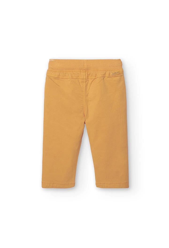 Basic elastic trousers for baby boy in yellow