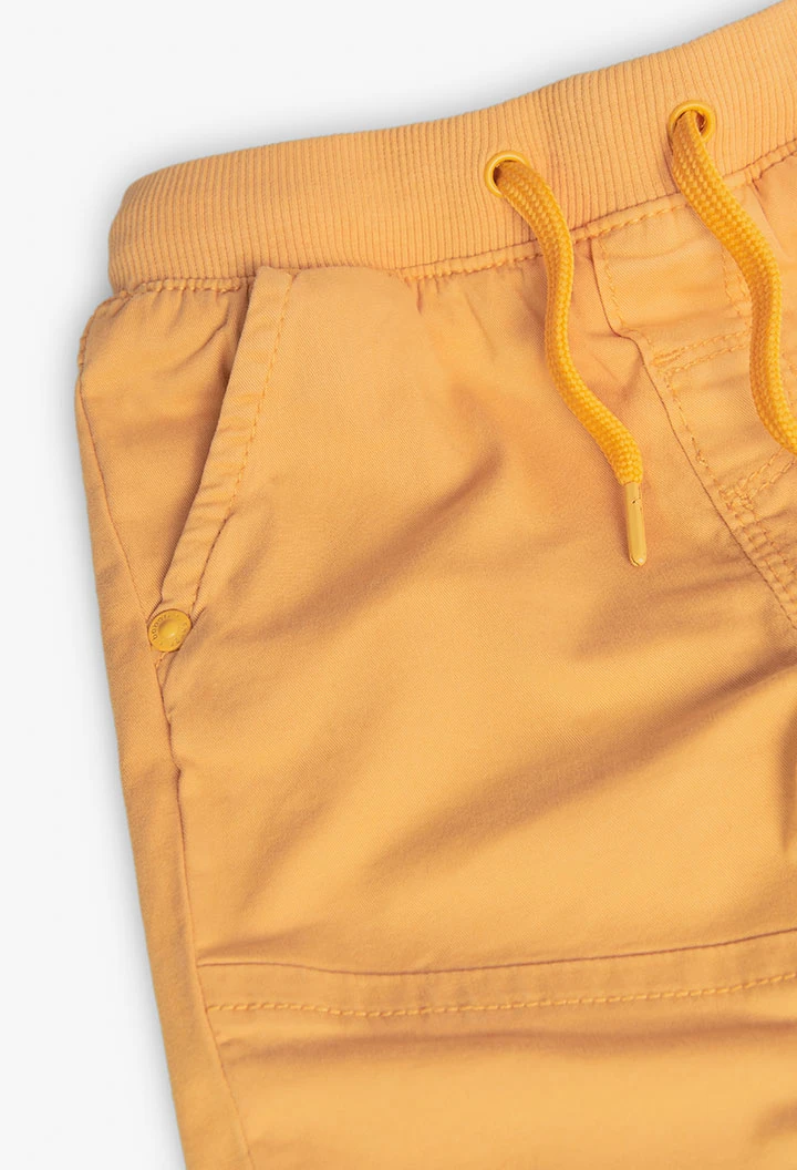 Basic elastic trousers for baby boy in yellow