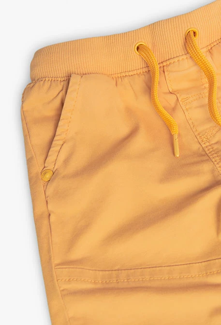 Basic elastic trousers for baby boy in yellow