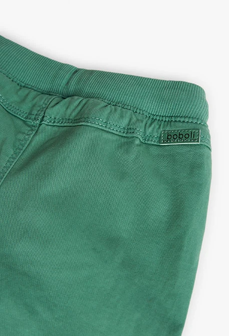Basic elastic trousers for baby boy in green