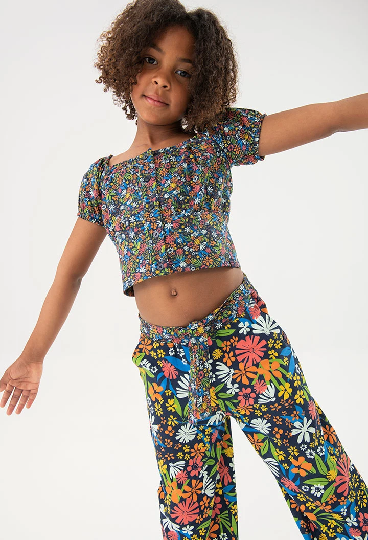 Calça de malha elástica para menina com estampado de flores