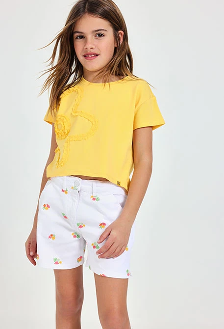 Bermuda en maille pour fille en blanc avec un motif de fleurs