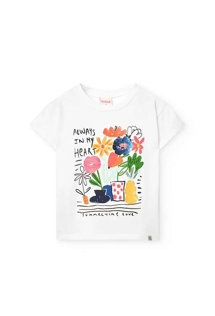 Maglietta a maglia per bambina in bianco con stampa floreale.