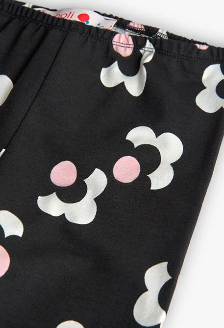 Black, pink, and white floral knit leggings