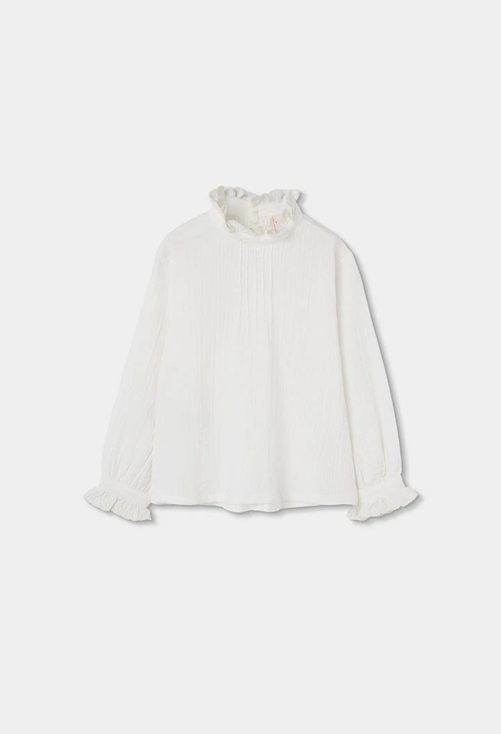 Blouse en mousseline blanche avec volants et col froncé