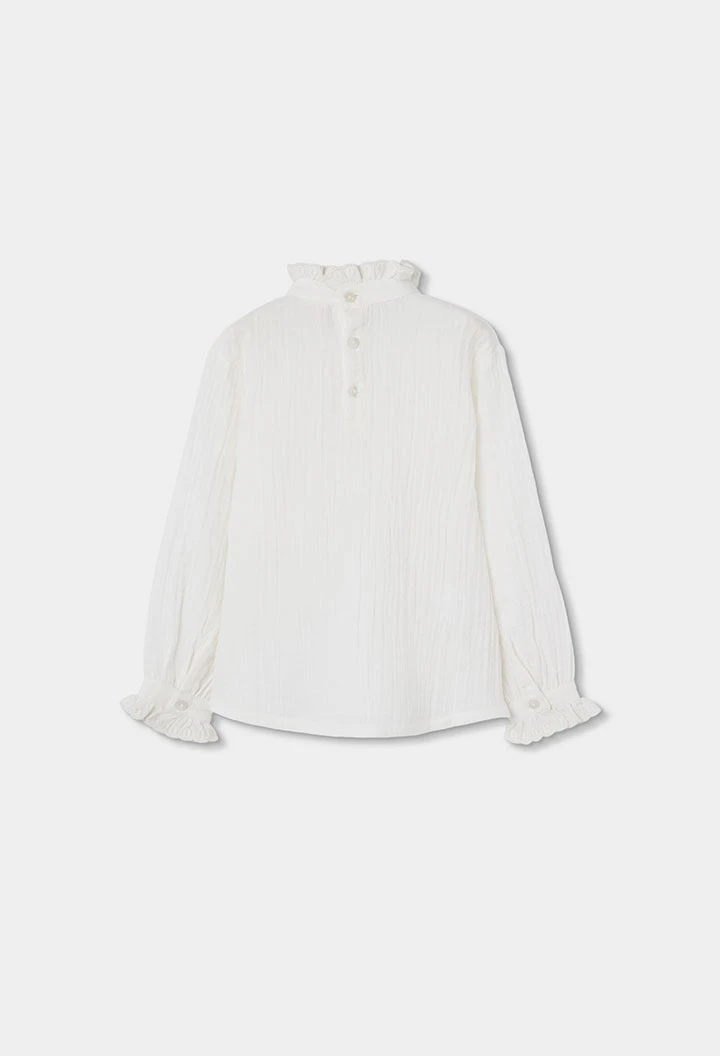 Blouse en mousseline blanche avec volants et col froncé