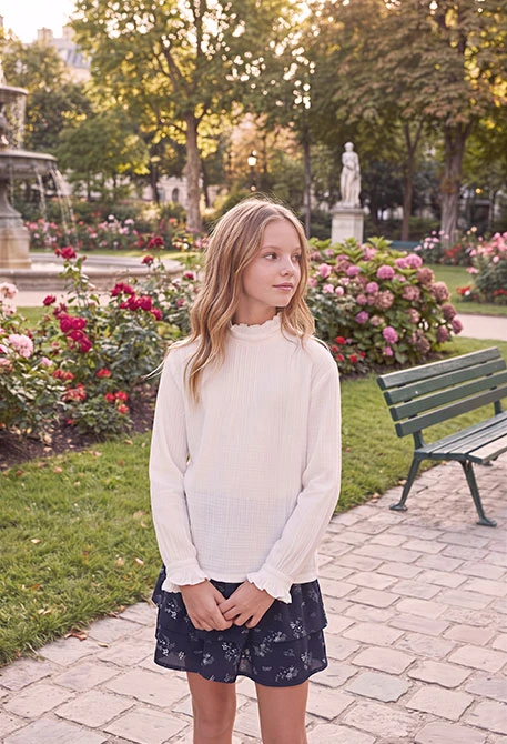 White muslin blouse with frills and gathered neckline