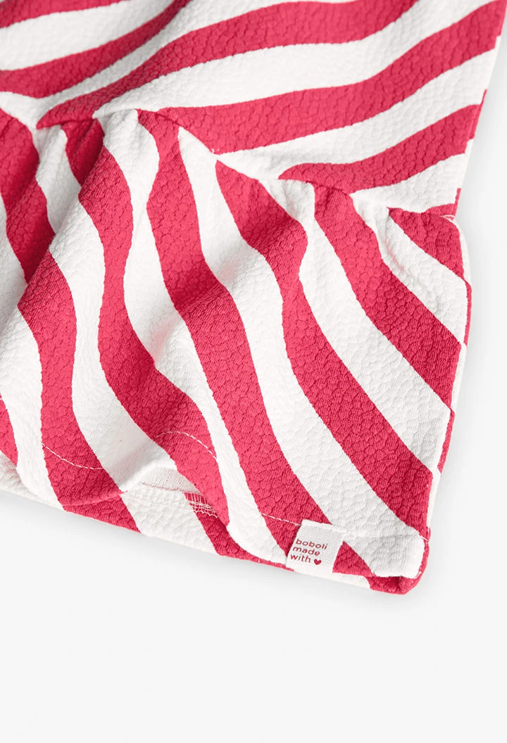 Vestito a maglia per bambina in colore rosso e bianco.