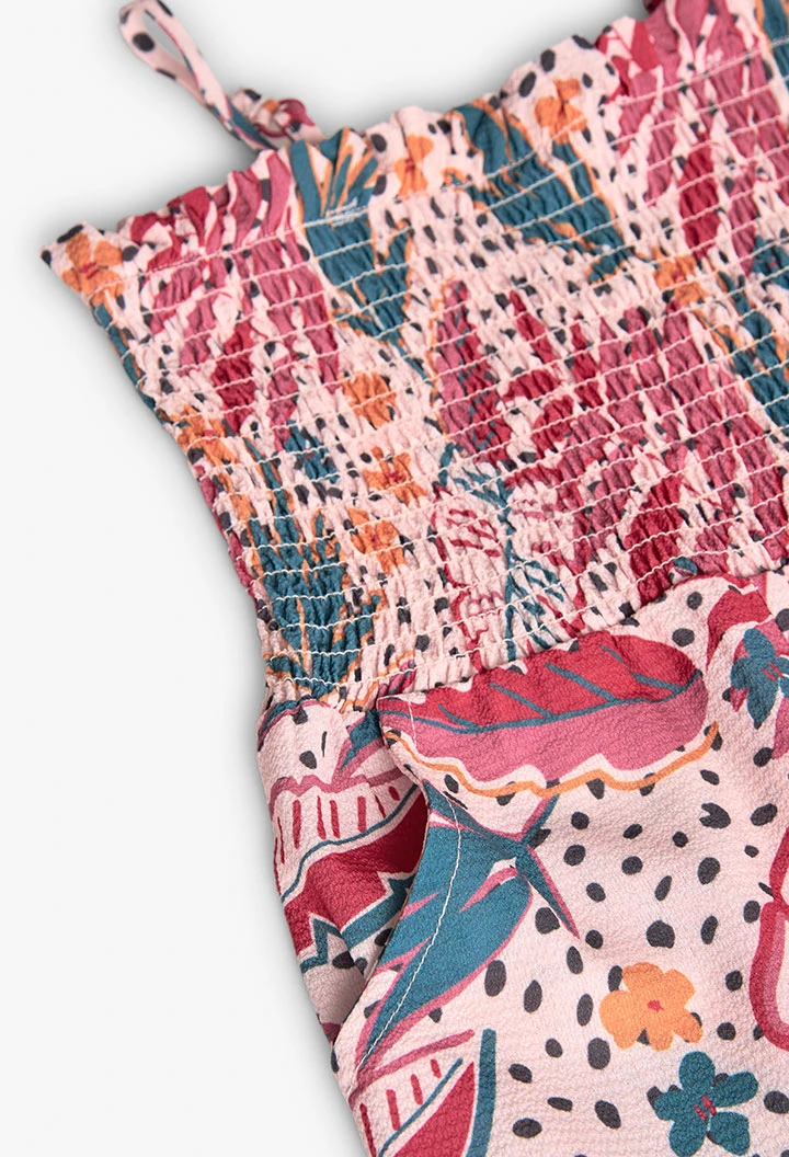 Combinaison en maille pour fille avec imprimé de fleurs et feuilles colorées en rose.