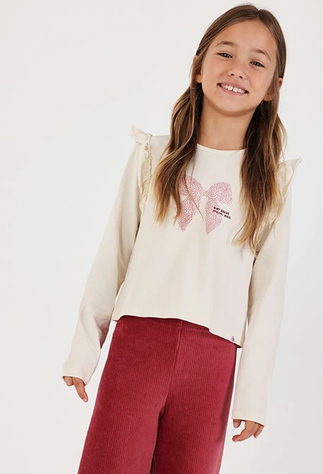 Mädchen-Strickshirt in Naturweiß mit rosa Schleifenaufdruck