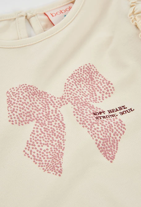 Mädchen-Strickshirt in Naturweiß mit rosa Schleifenaufdruck