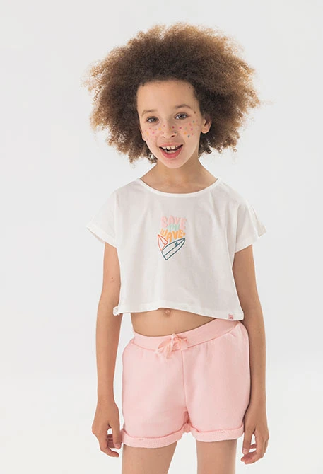 Camiseta de punto liso para niña en color blanco