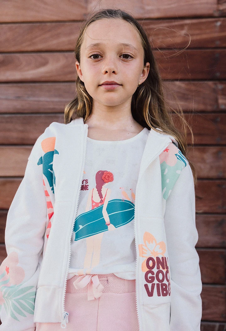 Maglietta a maglia per bambina di colore bianco con stampa da surfista