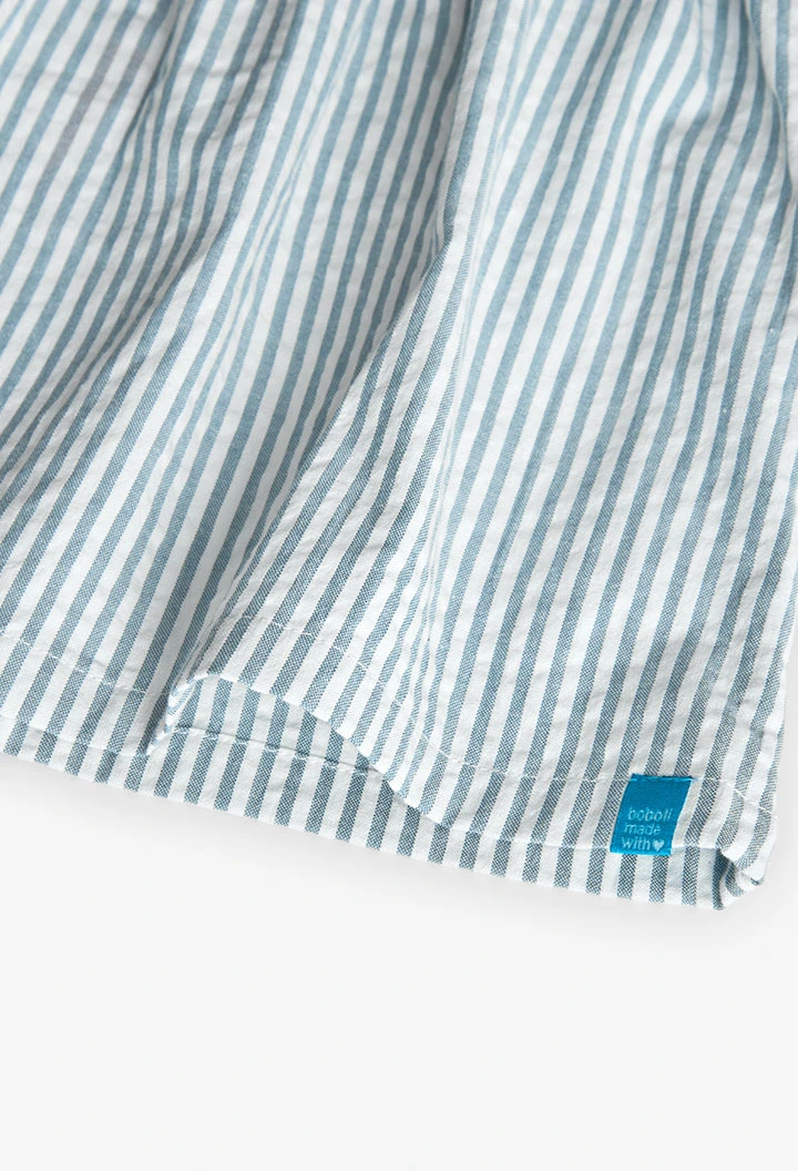 Top in popeline per bambina a righe blu e bianche.