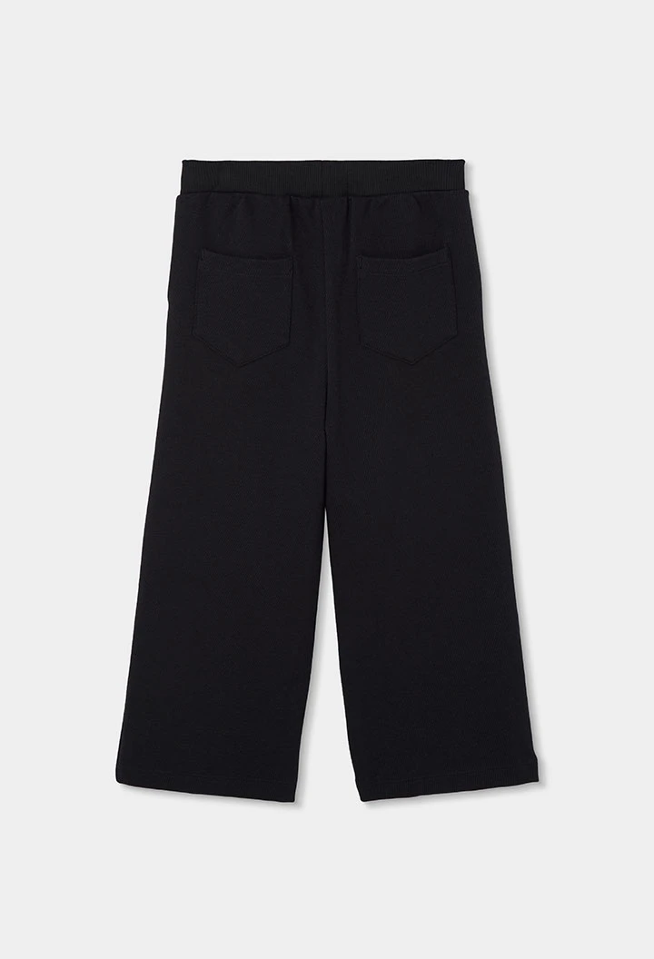 Pantalone in maglia da bambina nero con stelle